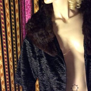 Vtg Brown fur collar on a black jacket